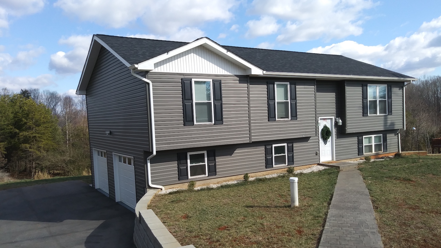 New black roof on a two-story home